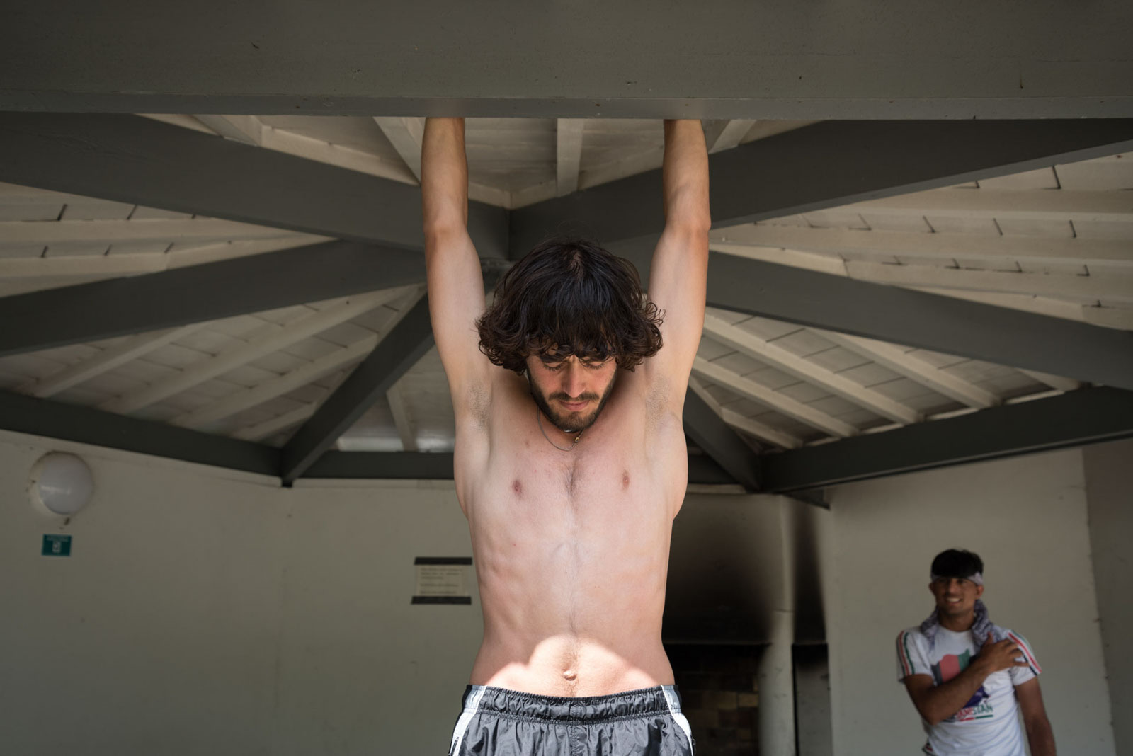 Nasir, a young Afghan refugee, does pull-ups in front of his friend at the Blasimon campsite during the Reborn Trip cycling tour of France in Nouvelle-Aquitaine on August 8, 2024.
Nasir, un jeune refugie afghan fait des tractions devant son ami au camping de Blasimon pendant la traversee de la France a velo de Reborn Trip en Nouvelle-Aquitaine le 8 aout 2024.