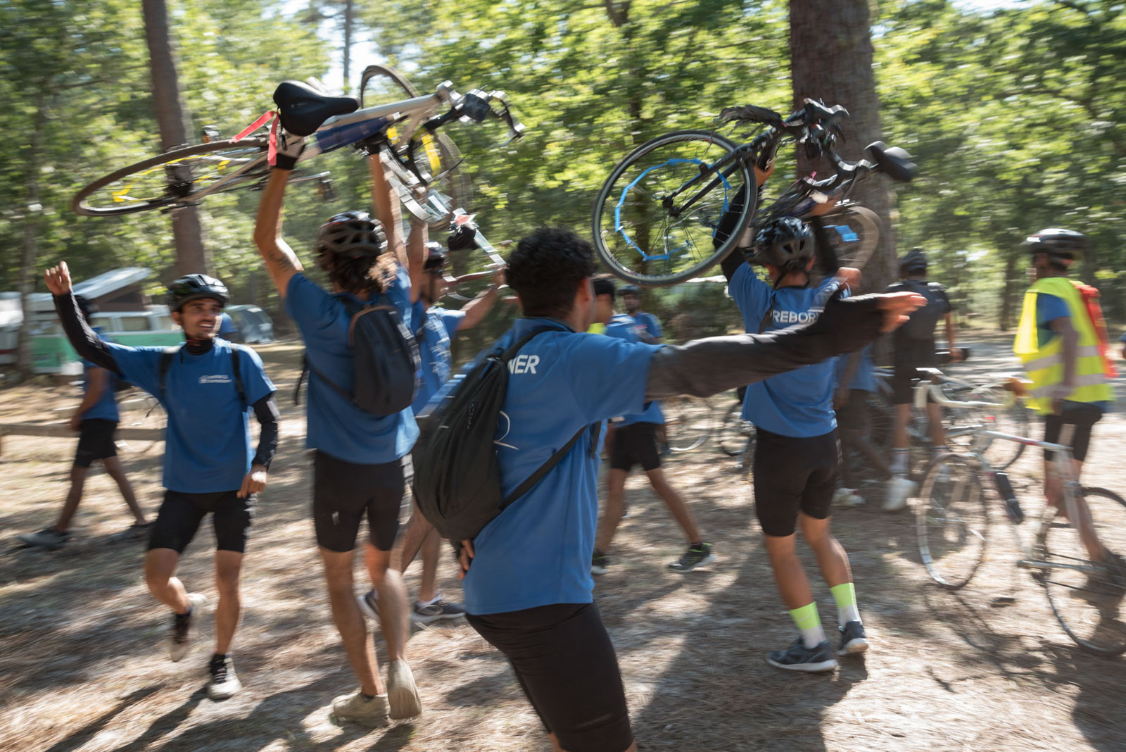 Refugees celebrate their arrival at the Villandraut campsite by raising their bikes in the air and dancing during the Reborn Trip bicycle tour of France in Nouvelle-Aquitaine on August 8, 2024.Les refugies fetent leur arrivee au camping de Villandraut en levant les velos dans l air et en dansant pendant la traversee de la France a velo de Reborn Trip en Nouvelle-Aquitaine le 8 aout 2024.