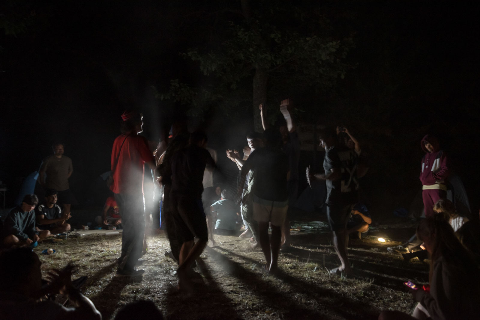 Refugees and volunteers dance in the evening at the Villandraut campsite after a day's pedalling during the Reborn Trip cycling tour of France in Nouvelle-Aquitaine on August 8, 2024.Des refugies et des benevoles dansent le soir au camping de Villandraut apres une jouree de pedalage pendant la traversee de la France a velo de Reborn Trip en Nouvelle-Aquitaine le 8 aout 2024.